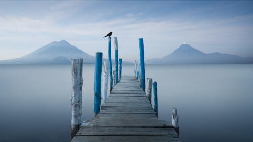 Peaceful dawn with view towards volcanoes Atitlan and San Pedro Peaceful dawn with view towards volcanoes Atitlan and San Pedro